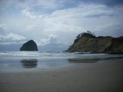 Haystack Rock rising from the surf at Cannon Beach, Oregon.